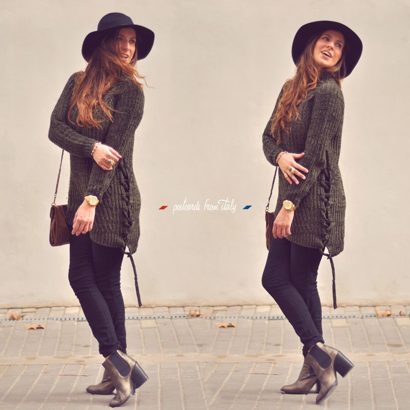 Outfit de jersei trenzado verde, sombrero negro y botines metalizados