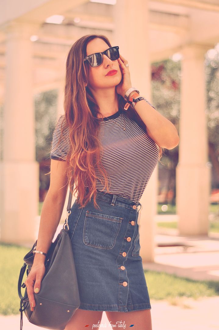High waisted denim skirt with striped t-shirt and red lips.