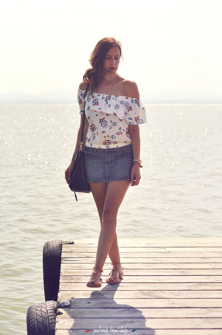 Off shoulder blouse and jeans skirt.