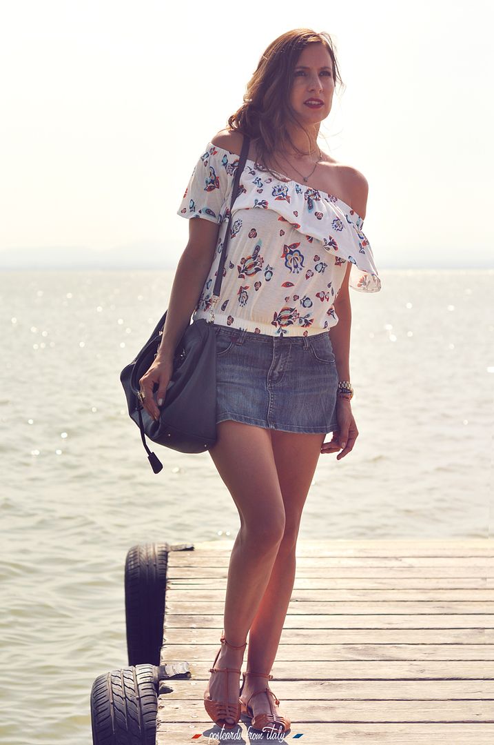 Off shoulder blouse and jeans skirt.