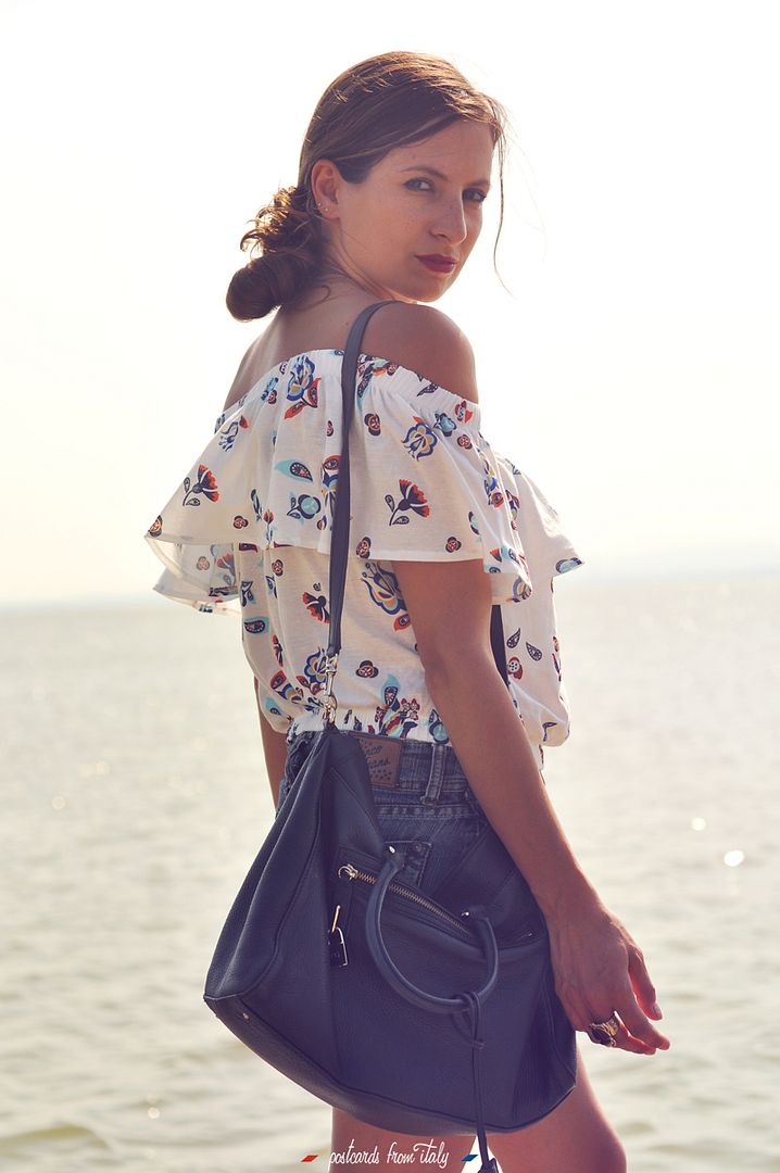 Off shoulder blouse and jeans skirt.