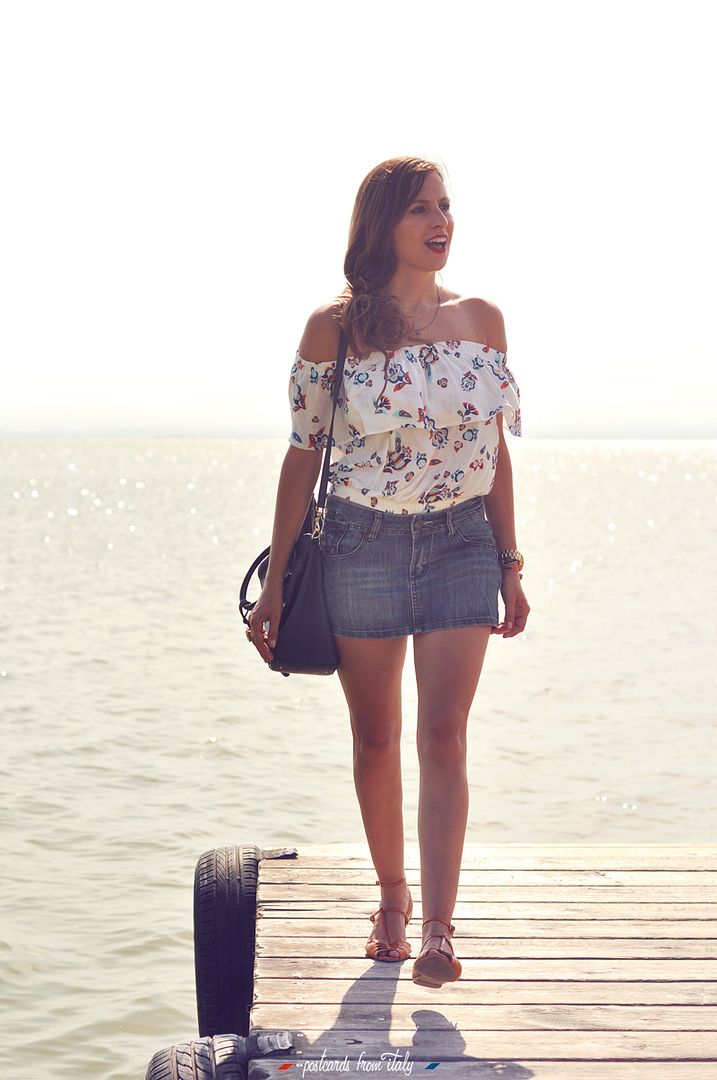 Off shoulder blouse and jeans skirt.