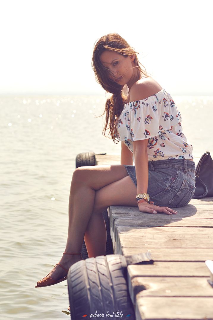 Off shoulder blouse and jeans skirt.