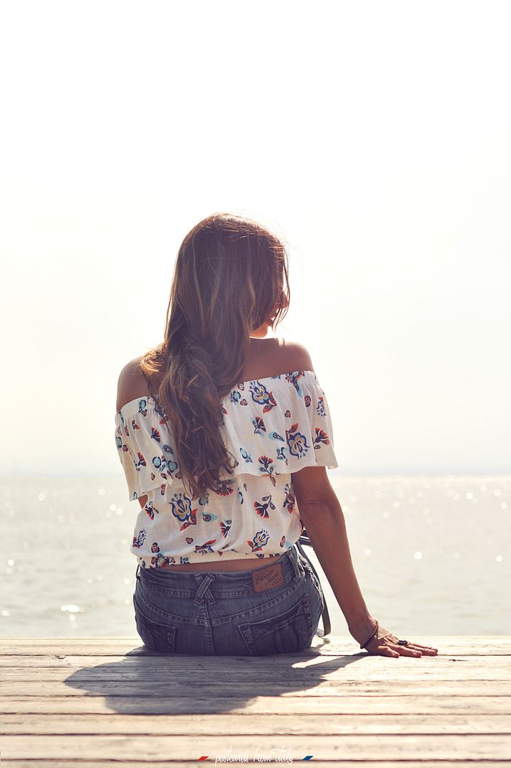Off shoulder blouse and jeans skirt.
